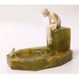Ivory figure of a bather on an onyx base. Condition report: see terms and conditions