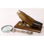 Animal foot with silver mounts on an oak base forming a paper keep and a magnifying glass with