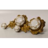 Pair of gilt metal and porcelain bell pulls. Condition report: see terms and conditions