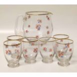 A 1930's glass lemonade set, comprising jug and six beakers, each with transfer decoration of