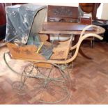 Victorian iron and wood pram Condition report: see terms and conditions
