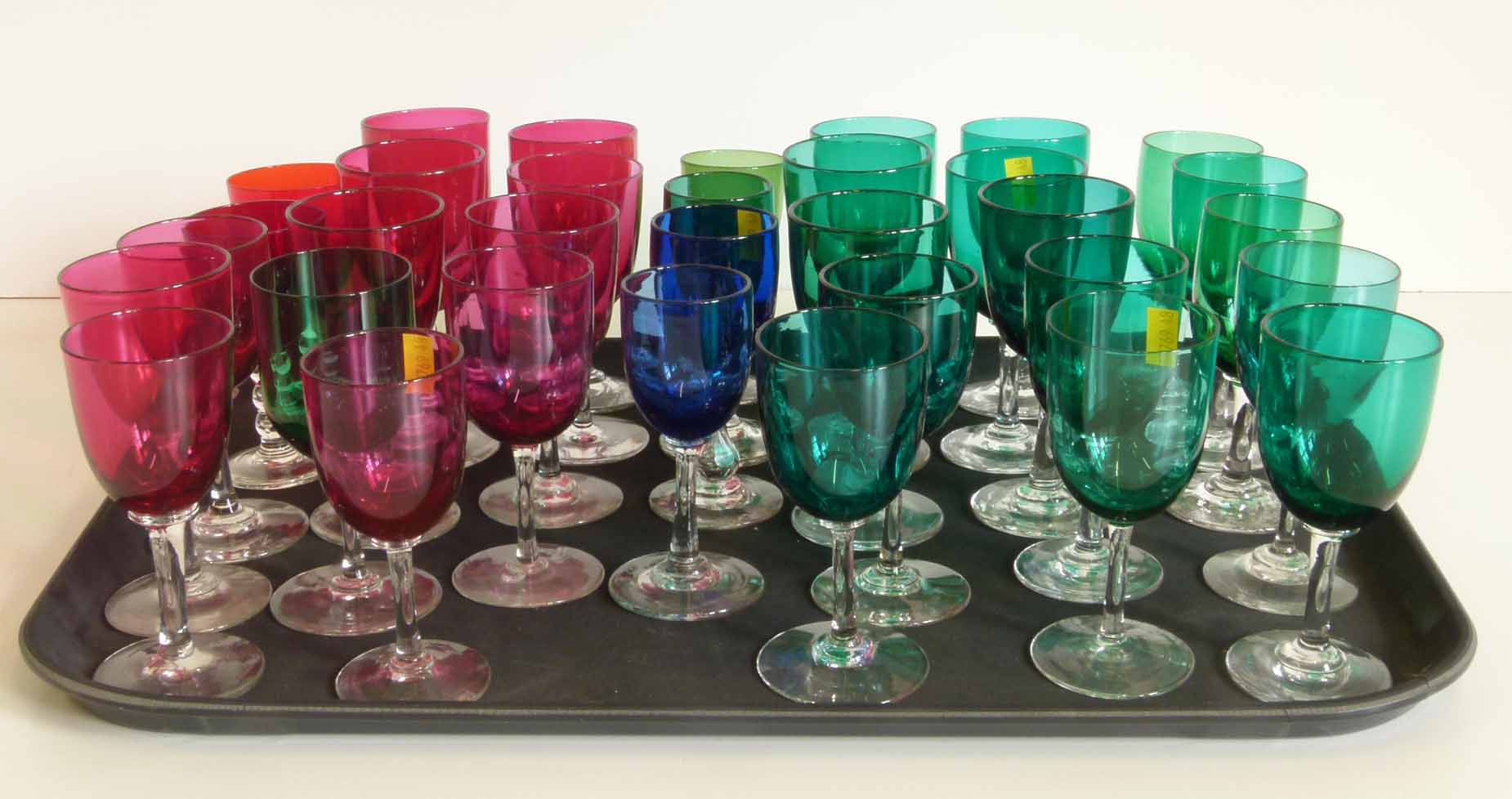 Thirty three Victorian coloured wine glasses. Condition report: see terms and conditions