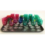 Thirty three Victorian coloured wine glasses. Condition report: see terms and conditions