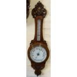 Edwardian oak aneroid barometer Condition report: see terms and conditions