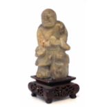 Chinese soapstone figure of Buddha, with a carved wood base. Condition report: see terms and