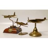 Three brass models on plinths of WW2 aeroplanes one bearing an RAF badge. Condition report: see