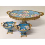 Modern Limoges table centre piece with two comports with gilt metal handles and decoration.