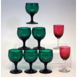 Six Victorian green wine glasses and a pair of red glasses. Condition report: see terms and