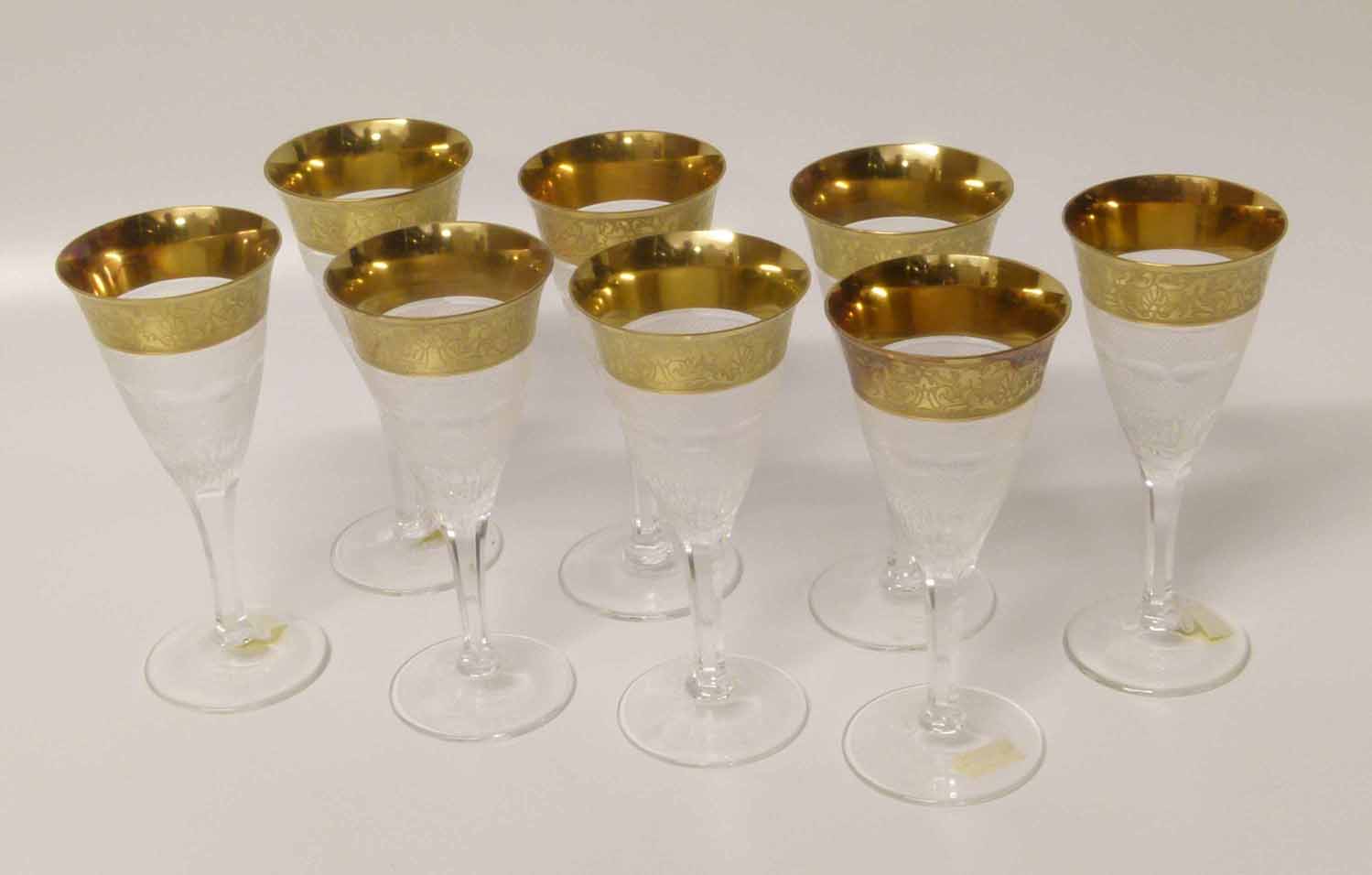 Eight cut glass Moser champagne flutes with gold decoration to rim. Condition report: see terms