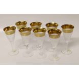 Eight cut glass Moser champagne flutes with gold decoration to rim. Condition report: see terms