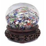 19th century scramble glass paperweight, set with millefiori and lattice canes, probably French,