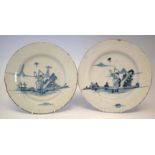 Pair of Delft plates, painted with a boy chasing a butterfly in blue, mid 18th century, (2) 26.5cm