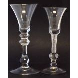Two wine glasses, one of baluster type with bell shape bowl and multiple knop stem on plain foot,
