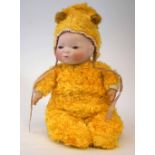 Grace and Putnam baby doll, with sleep eyes, dressed in yellow furry costume, 36cm high Condition