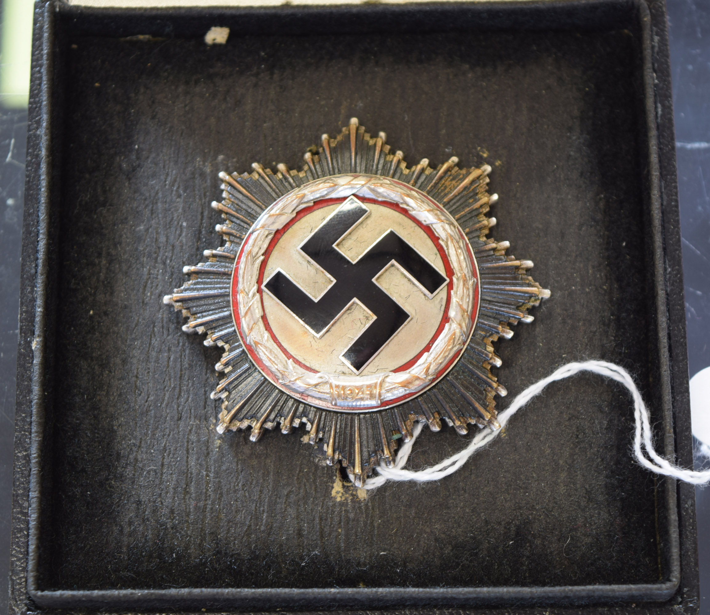 A rare Second World War Nazi German Cross in silver with black enamel Swastika to centre and red - Image 3 of 9