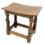 Robert "Mouseman" Thompson Oak Dish Top Stool, with four octagonal legs joined by stretchers and