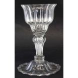 Sweet meat glass, with ribbed bowl, stem and folded foot, mid 18th century, 18cm high Condition