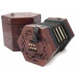 William Sprague 32 key concertina, with pierced mahogany end plates, fitted with stained and