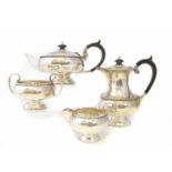 Silver four piece tea set by Walker & Hall, comprising of tea pot, water jug, milk jug and sugar