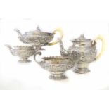 Georgian silver four piece tea set comprising tea pot, hot water pot, milk jug and sucrier, the