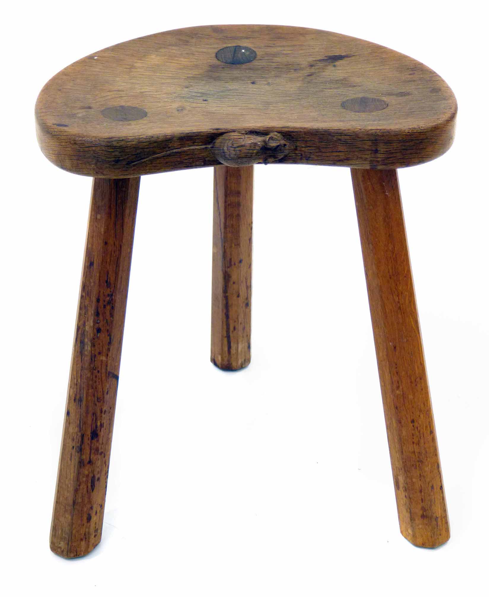 Robert "Mouseman" Thompson oak calf stool, with three octagonal legs and carved mouse signature,