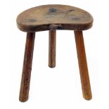 Robert "Mouseman" Thompson oak calf stool, with three octagonal legs and carved mouse signature,