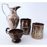 Four items of silver comprising a spiral fluted milk jug, Sheffield hallmark 1893, two christening