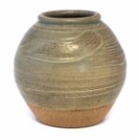 Jim Malone (1946-) vase, incised with a wavy lines and decorated with a green glaze, impressed