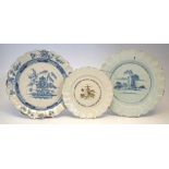 Two Bristol Delft chargers and a plate circa 1750, two painted with landscapes with bianco-sopra-