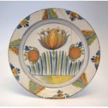 Delft charger possibly Bristol, painted with tulips, early 18th century, 33cm diameter Condition