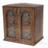 Victorian walnut collectors / smoker's cabinet, with twin Gothic arch bevelled glazed doors, the