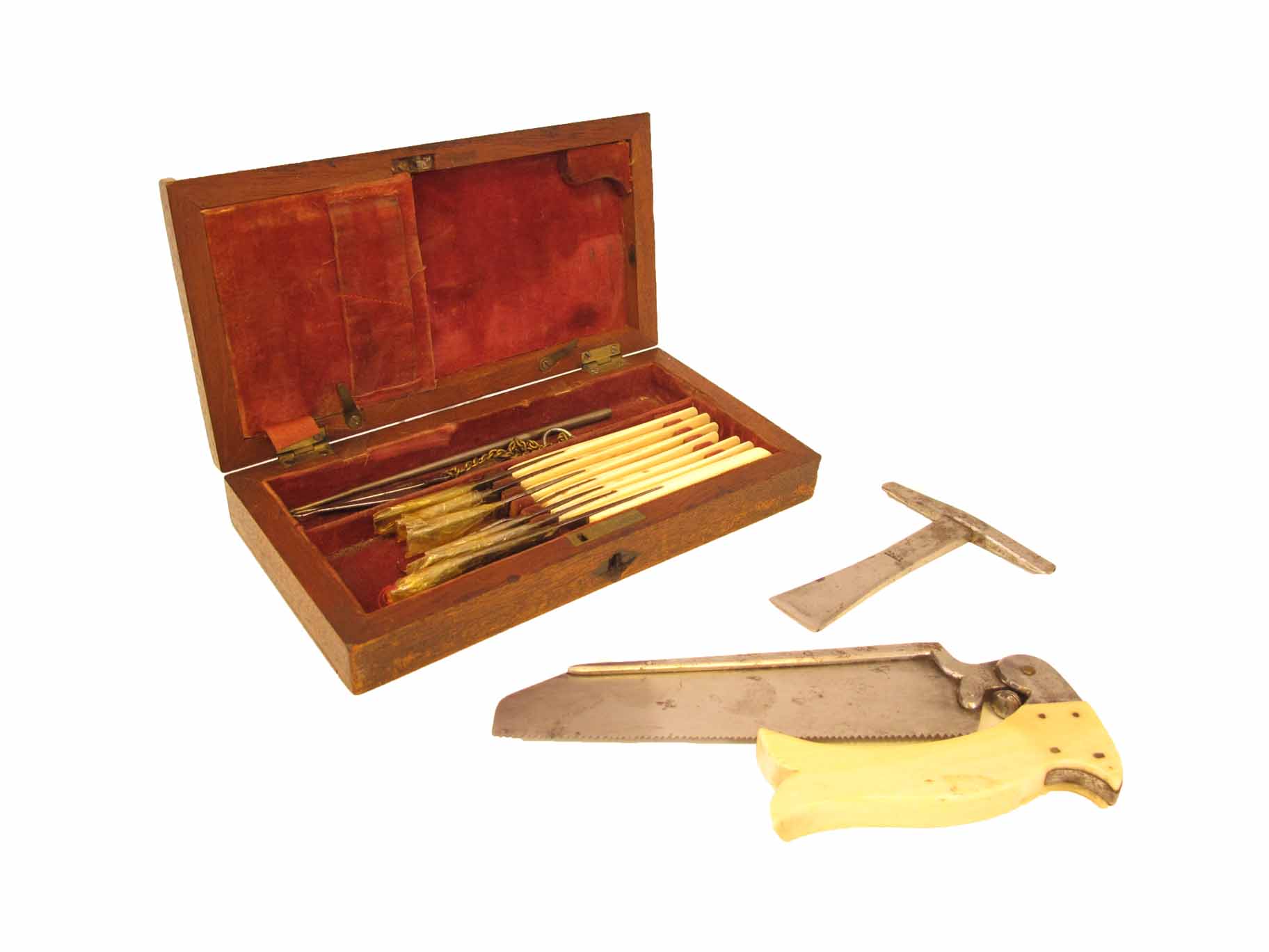 A 19th century mahogany cased field amputation kit, the fitted interior with an ivory handled