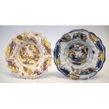 Two lobed Delft dishes, Lambeth of Bristol, each painted with a figure within landscape in blue,