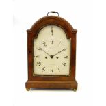 A Regency mahogany cased table clock, the white enamel dial signed Baker, Tamworth, with arched top,