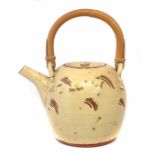 William 'Bill' Marshall (1923-2007) teapot, with cream/yellow cut through glaze dotted in green,