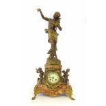 A 19th century French mantel clock, the marble base with a rococo style gilt spelter mount flanked