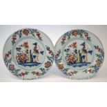 Pair of Delft plates possibly Brislington, painted in polychrome with exotic birds, mid 18th