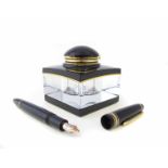 Square black/gilt Mont blanc inkwell and fountain pen.