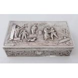 A silver trinket box embossed country figure scene to a hinged lid, scroll and flower head