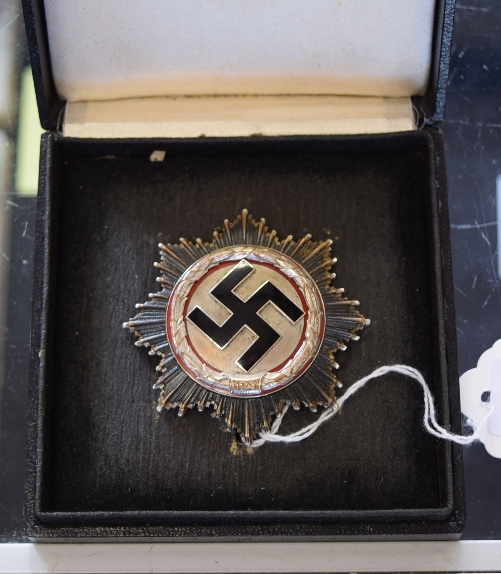 A rare Second World War Nazi German Cross in silver with black enamel Swastika to centre and red - Image 2 of 9