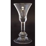 Baluster wine glass circa 1740, with bell shaped bowl, plain stem with knop separating the stem from