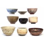 Nine Studio Pottery bowls, mostly unmarked or with indistinct painted marks relating to glazes,