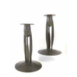 A pair of Archibald Knox for Tudric pewter candlesticks, model 0223, the oval sockets raised on