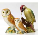 Beswick figure woodpeckers and two owls. Condition report: see terms and conditions.