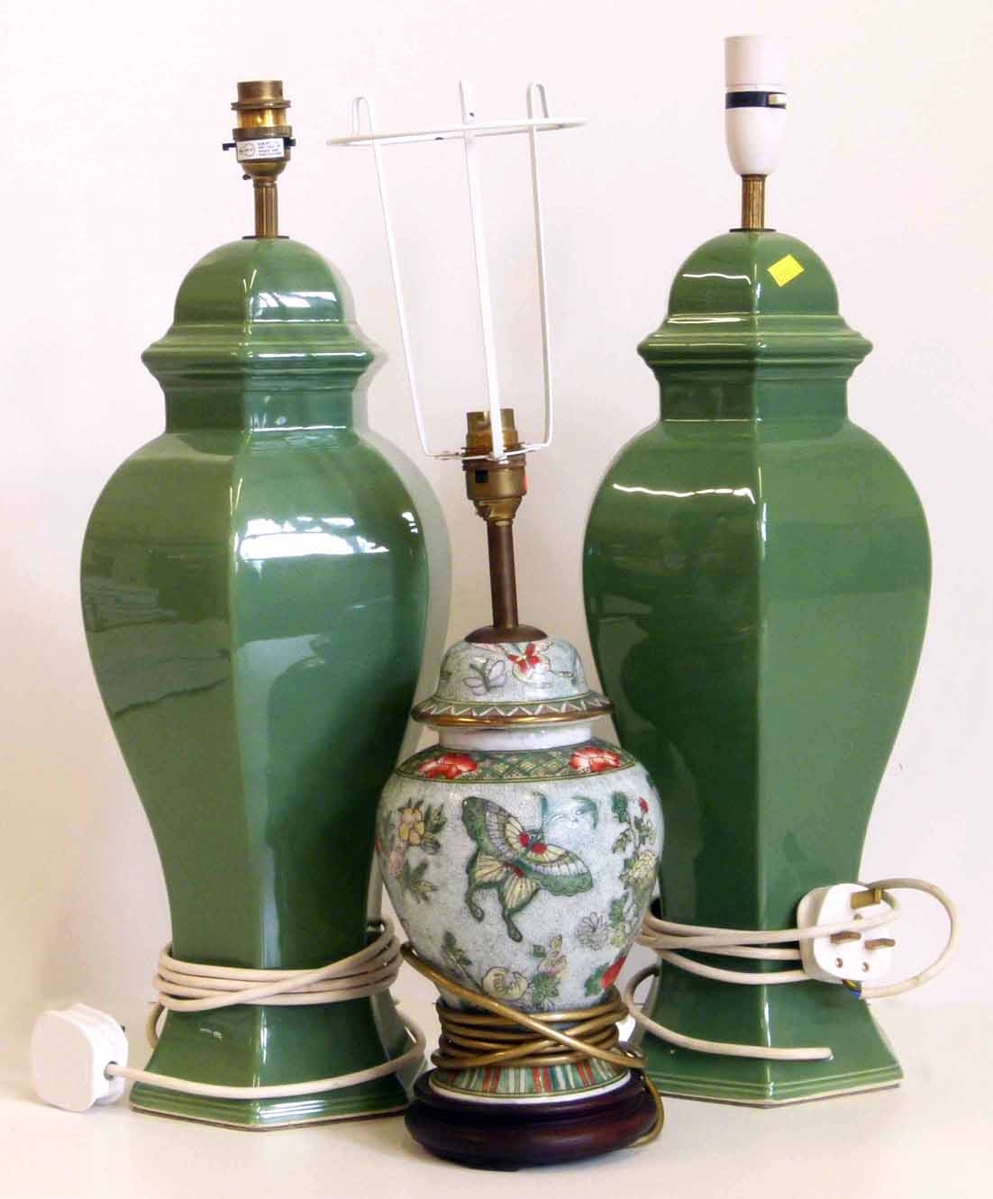 Pair of green glazed pottery table lamps Condition report: see terms and conditions.