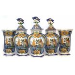 Garniture of five Delft vases, three with bird finial covers, the bodies of hexagonal form moulded