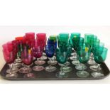 Thirty three Victorian coloured wine glasses. Condition report: see terms and conditions.
