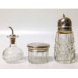 Three silver topped glass jars. Condition report: see terms and conditions.