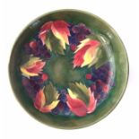 Moorcroft bowl, decorated with Leaves and Berries pattern on green ground, impressed and painted