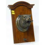 Bronze tiger head mounted on oak plaque probably for a dinner gong. No condition reports for this